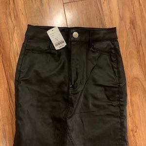 Shiny black mini skirt. Brand new with tags